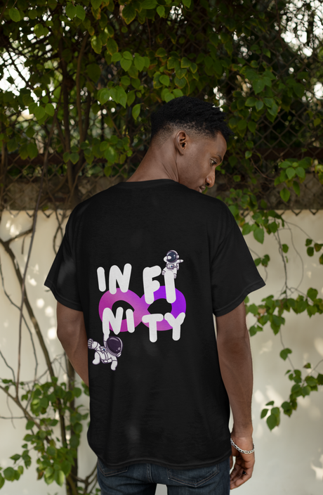 back-view-t-shirt-mockup-featuring-a-man-posing-against-a-wall-with-plants-m37880